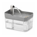 Fontaine à eau cube Museau, coloris gris fumé, bac transparent et bec en acier inoxydable